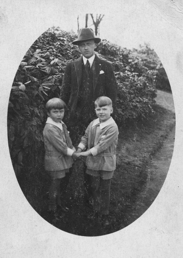 Friedrich Bader and his sons Menashe (right) and George in the park. Köln, Germany, 1930s